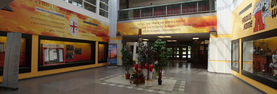 Cross and banners in the front lobby of high school